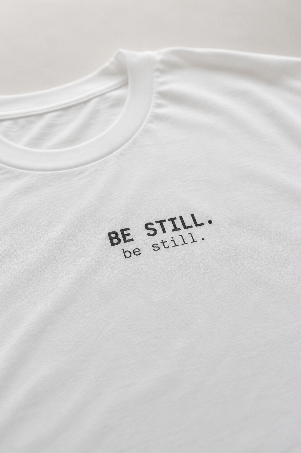Be Still. T-Shirt | Minimalist Script | Regular Fit