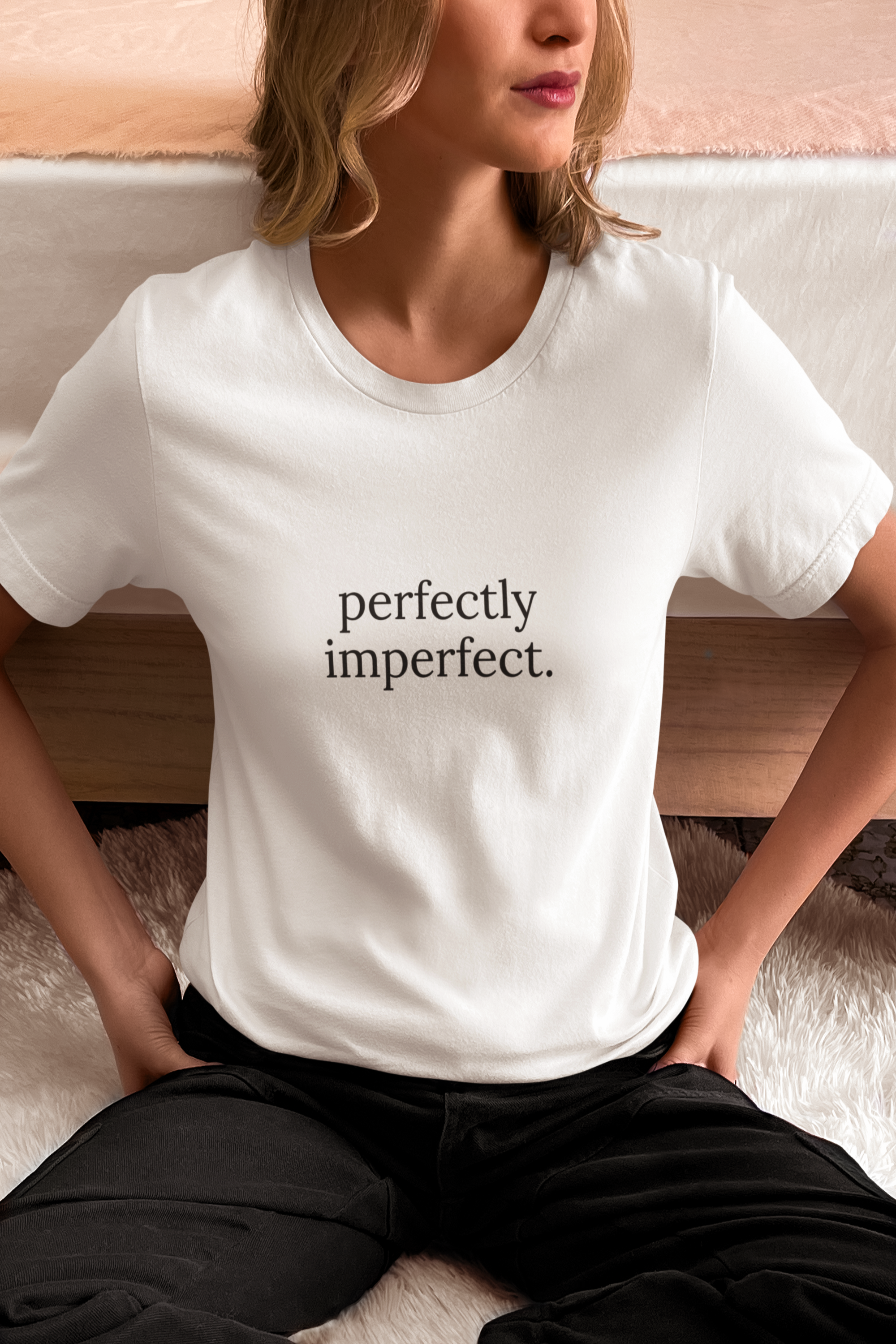 Person wearing a white t-shirt with a provocative message in yellow text.