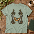Cat reading in a hammock on muted sage Bay tee