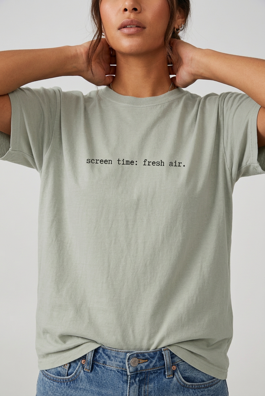 Woman wearing Bay screen time fresh air t-shirt, close-up editorial lifestyle
