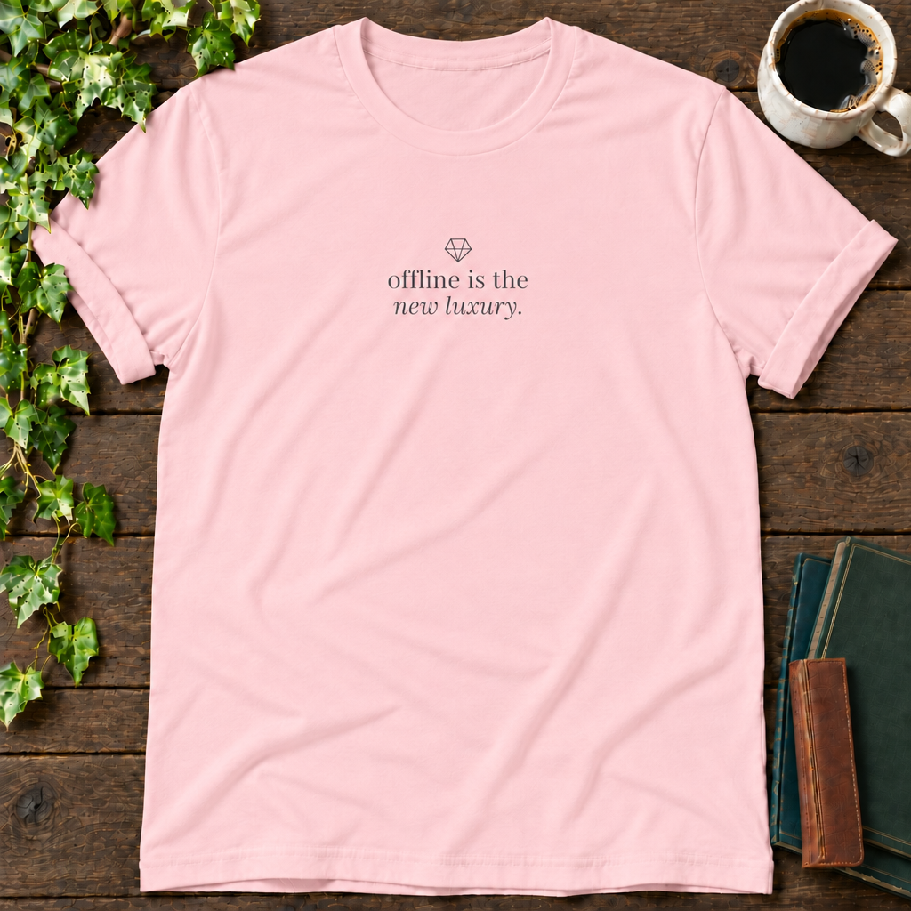 offline is the new luxury. pink t-shirt flat lay
