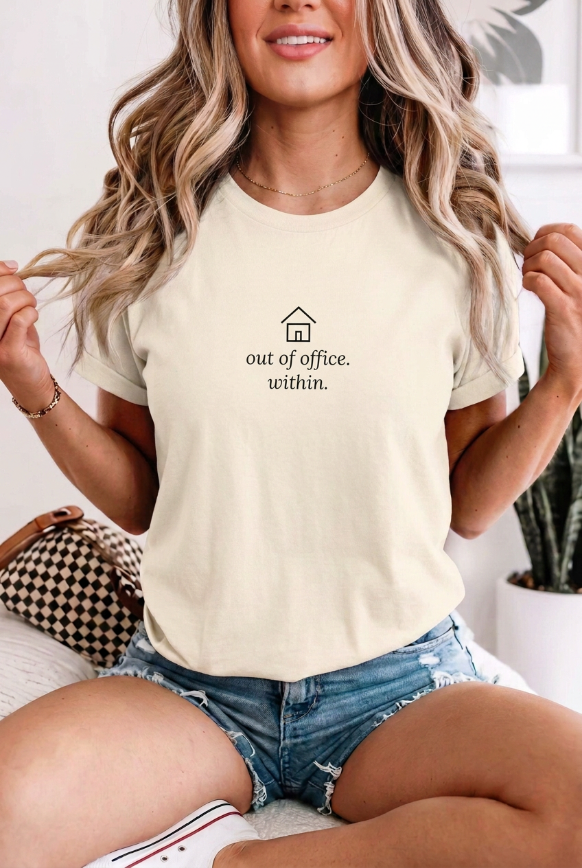 Blonde adult woman wearing Ivory out of office within t-shirt