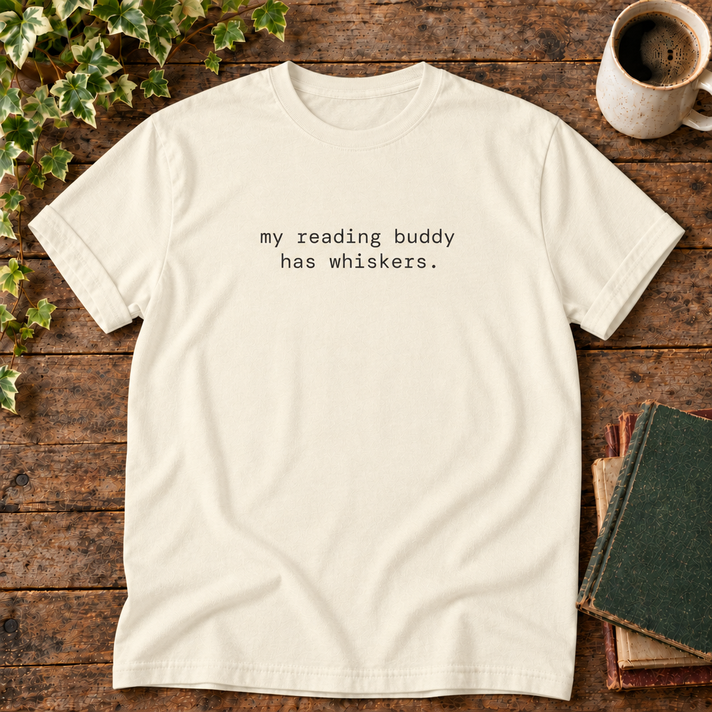 Ivory tee with my reading buddy has whiskers text in rustic flat lay