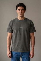 Man wearing pending. t-shirt in Pepper
