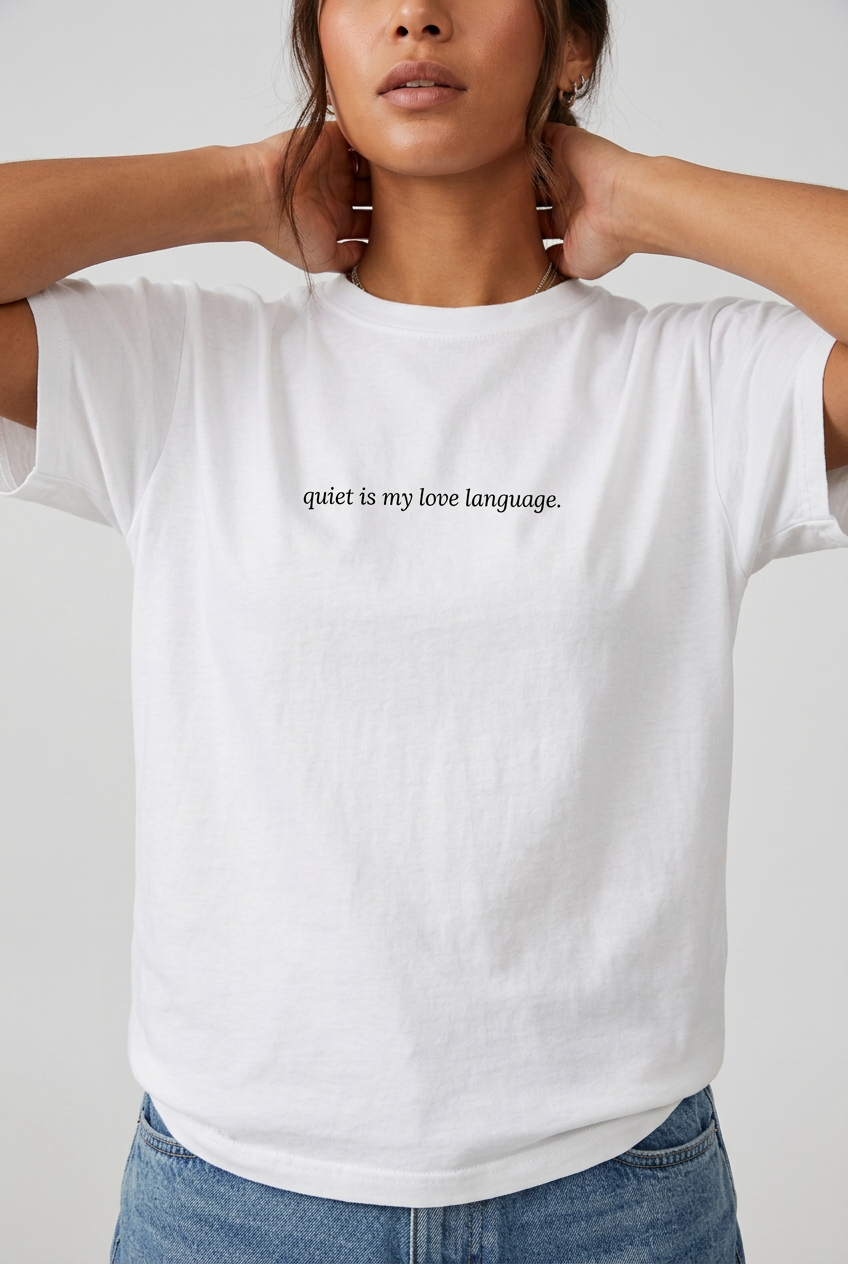 Woman wearing White quiet is my love language t-shirt, close-up editorial lifestyle