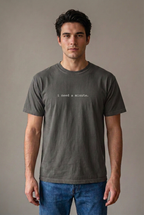 Man wearing i need a minute. Pepper t-shirt