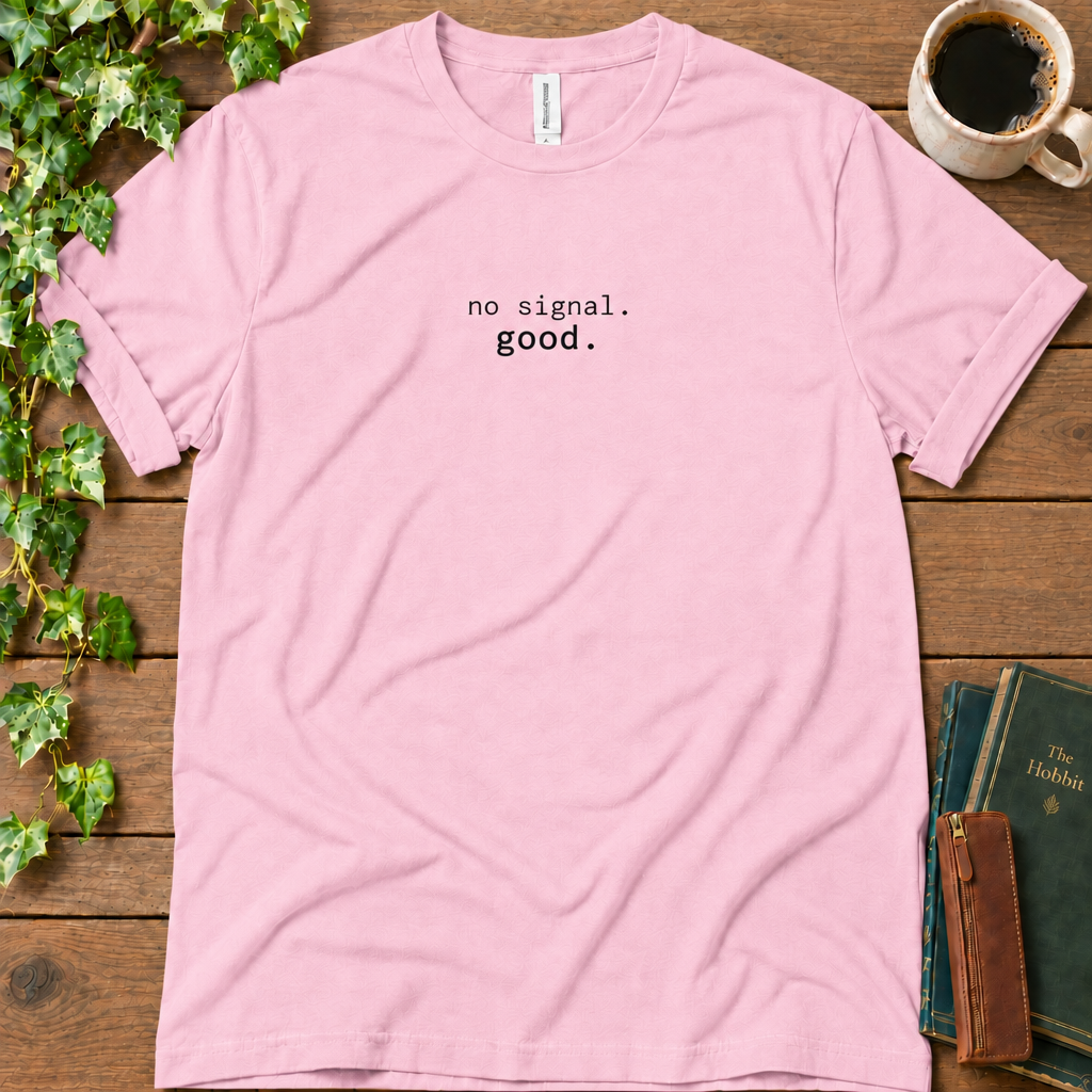 Pink regular-fit tee printed with no signal. good., flat lay on rustic wood with ivy, coffee and vintage books