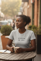 minding my own. — dark-skinned woman, athletic heather Bella Canvas, café