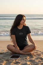offline is the new luxury — black tee, ocean lifestyle, iPad face-down
