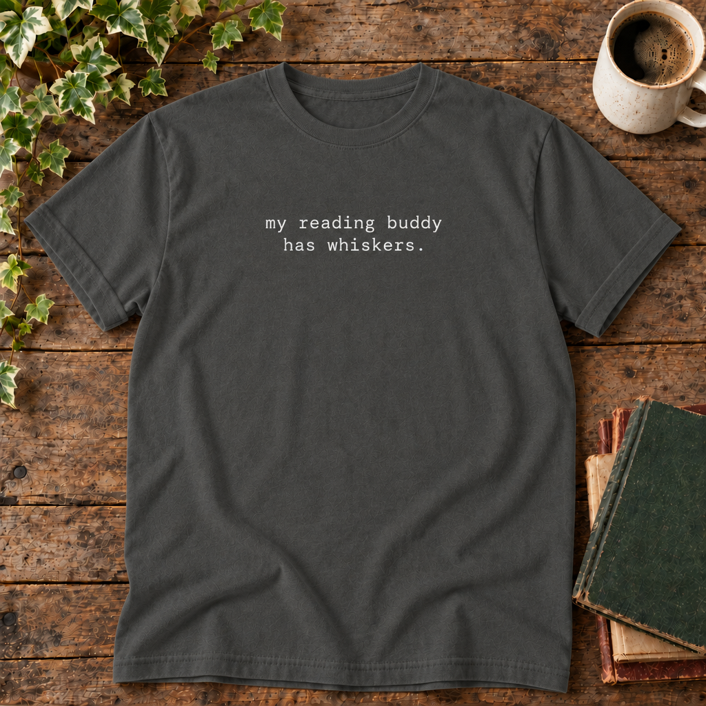 Pepper tee with my reading buddy has whiskers text in rustic flat lay