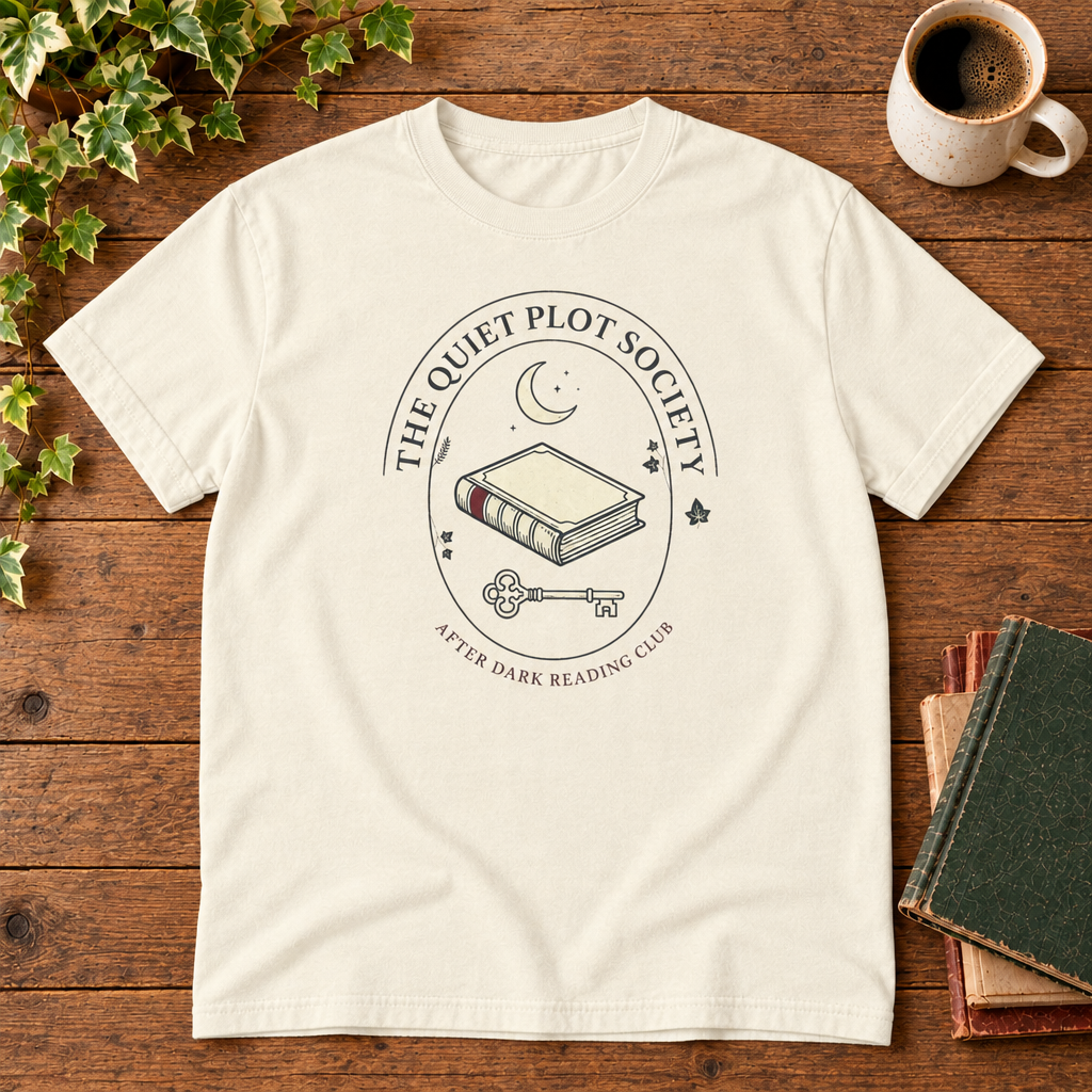 The Quiet Plot Society tee in Ivory, flat lay with book and coffee