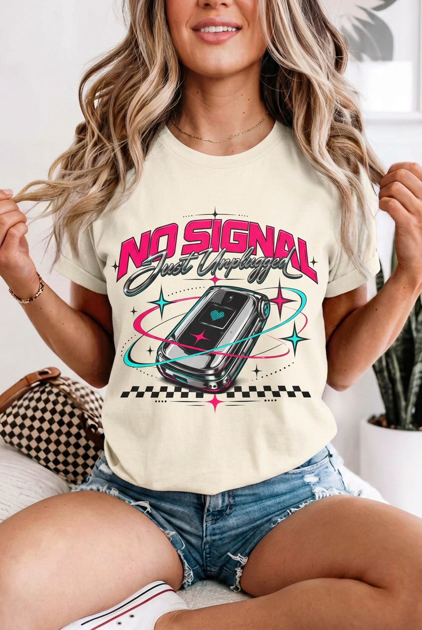 Seated blonde model in denim shorts wearing no signal retro t-shirt in Ivory