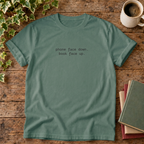 Phone face down T-shirt in Blue Spruce, stylised flat lay with blank neckline