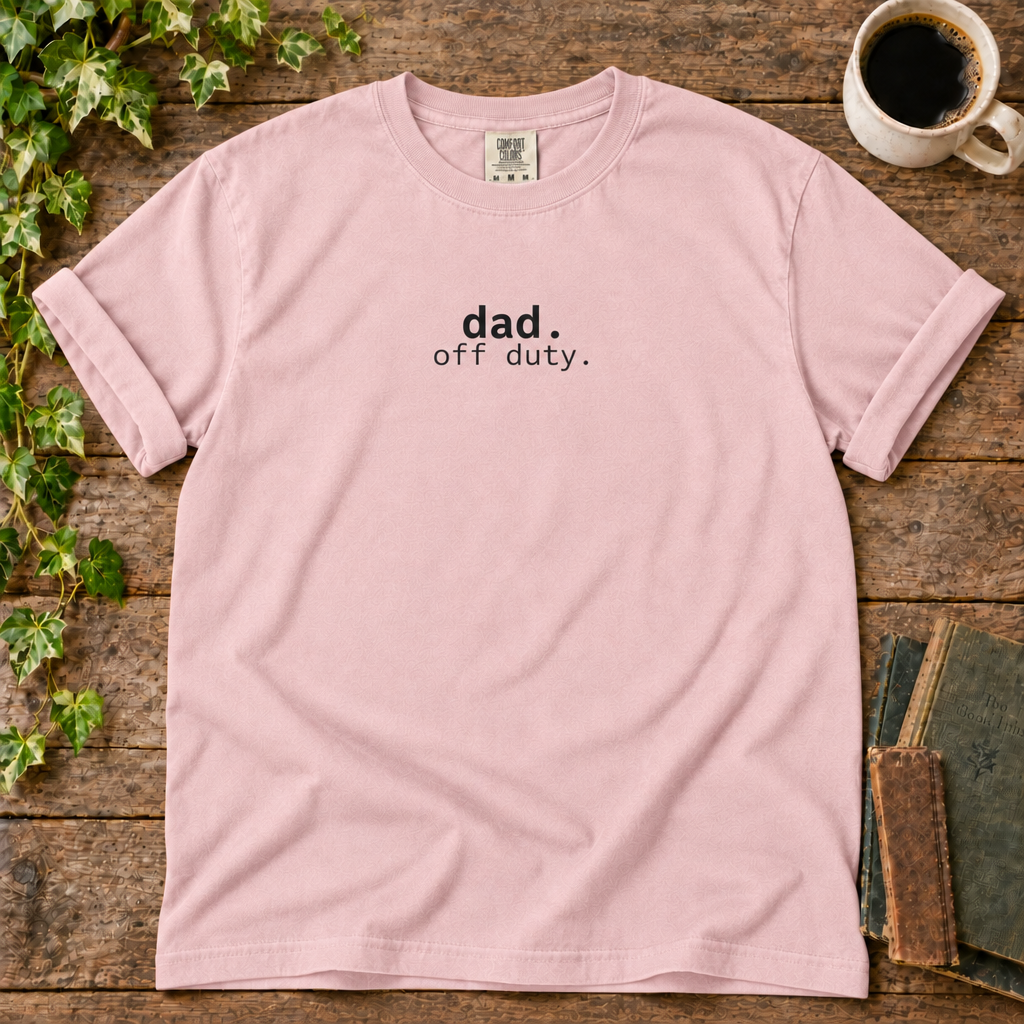 Blossom relaxed-fit tee printed with dad off duty, flat lay on rustic wood with ivy, coffee and vintage books