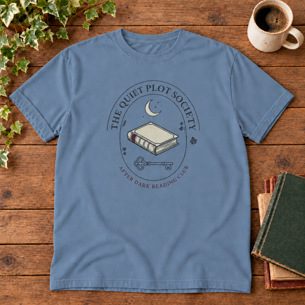 The Quiet Plot Society tee in Blue Jean, flat lay with book and coffee