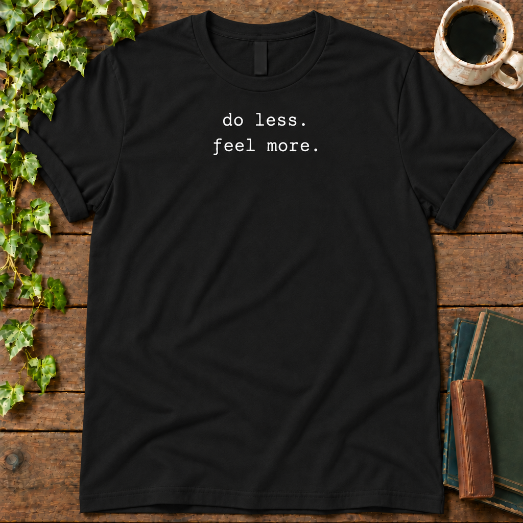 do less. feel more. black t-shirt flat lay