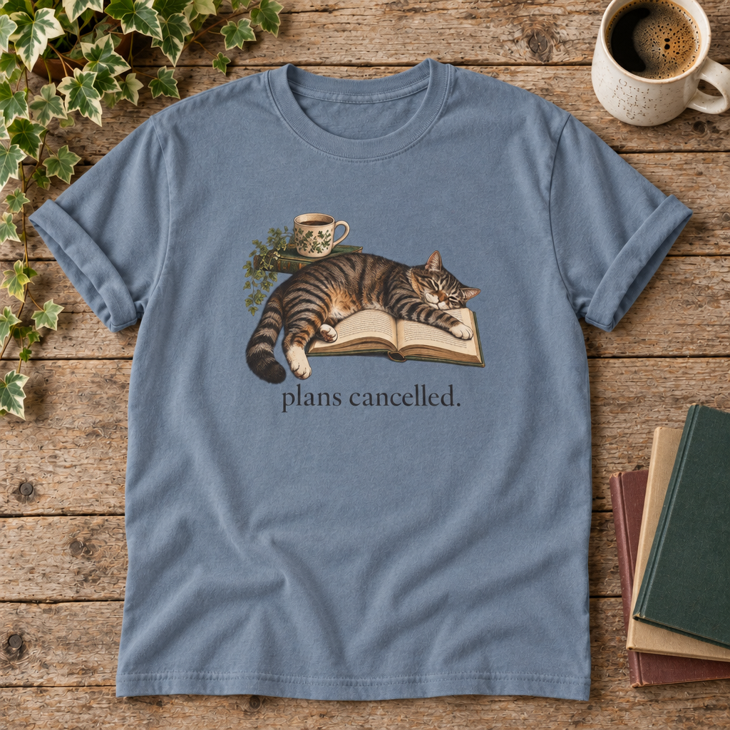 Plans cancelled. Blue Jean cat and book t-shirt flat lay