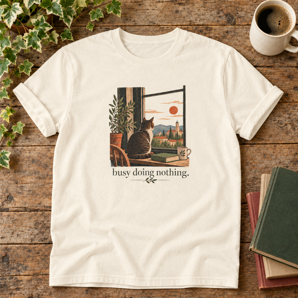 Busy doing nothing. Ivory cat at window t-shirt flat lay