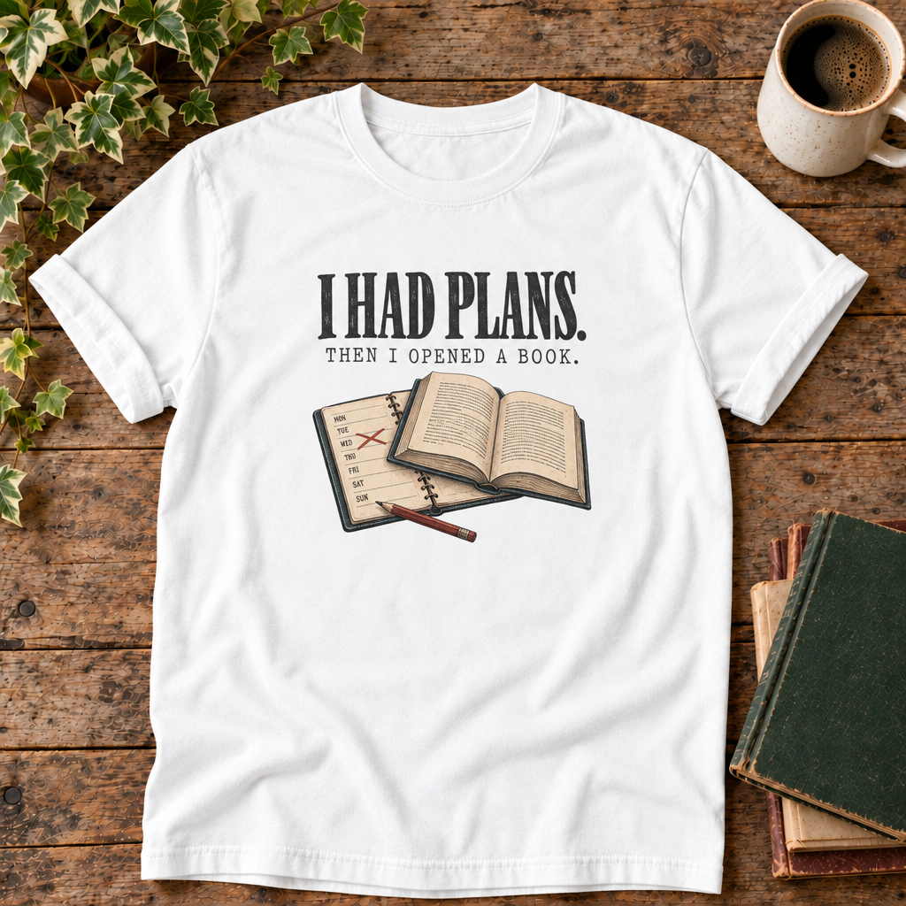I had plans t-shirt in White, flat lay on dark rustic wood with ivy, coffee mug and green-over-red-and-tan book pile