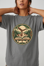 Close-up model wearing mountain adventure vintage t-shirt in Grey