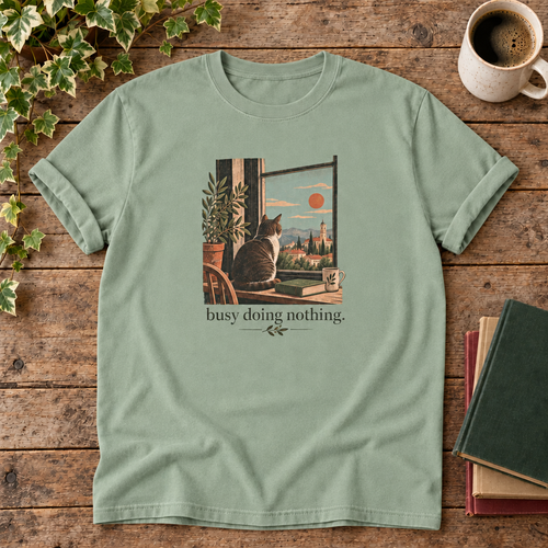 Busy doing nothing. Bay cat at window t-shirt flat lay