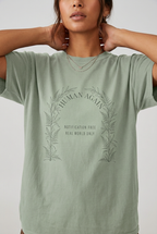 Close-up model wearing human again t-shirt in Bay