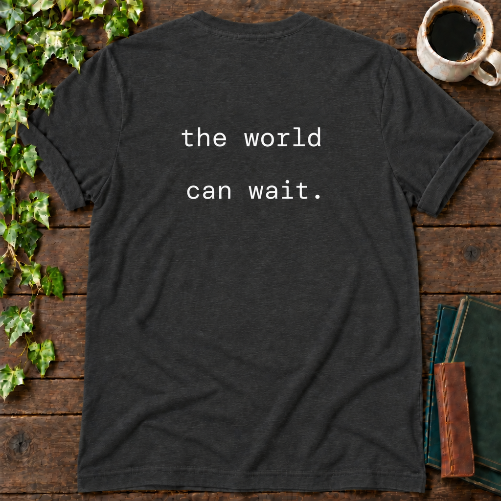 the world can wait. dark grey heather t-shirt back print flat lay