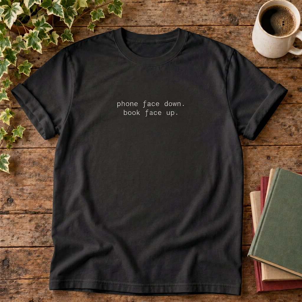 Phone face down T-shirt in Black, stylised flat lay with blank neckline