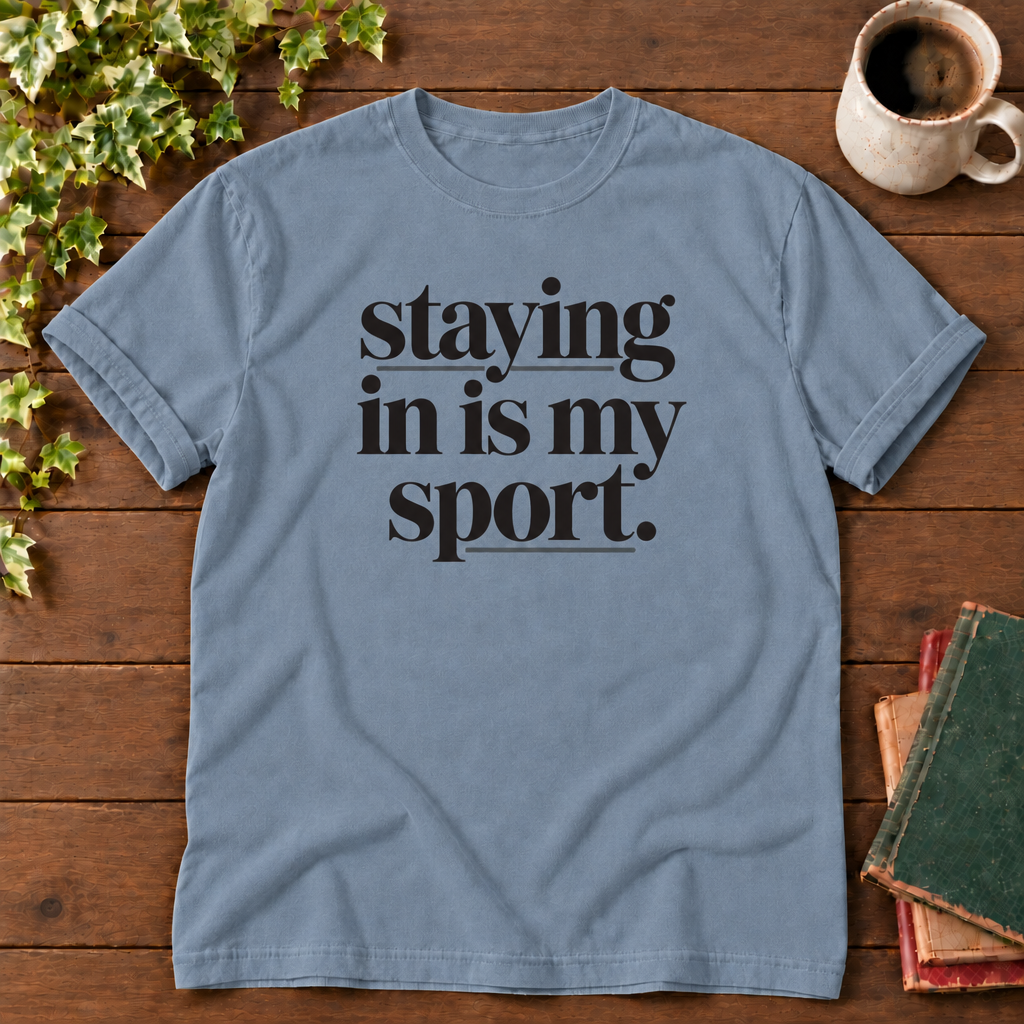 Staying in is my sport Blue Jean, folded sleeve flat lay with smooth timber, mug and books