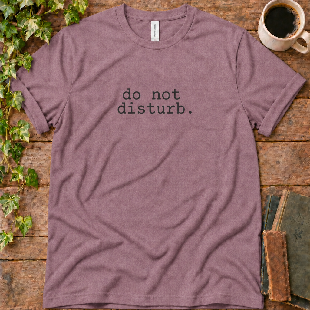Mauve regular-fit tee printed with do not disturb, flat lay on rustic wood with ivy, coffee and vintage books