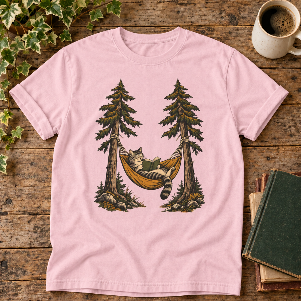 Cat reading in a hammock on Blossom pink tee