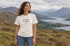 Woman wearing the ivory currently elsewhere. t-shirt and blue jeans in the Scottish Highlands