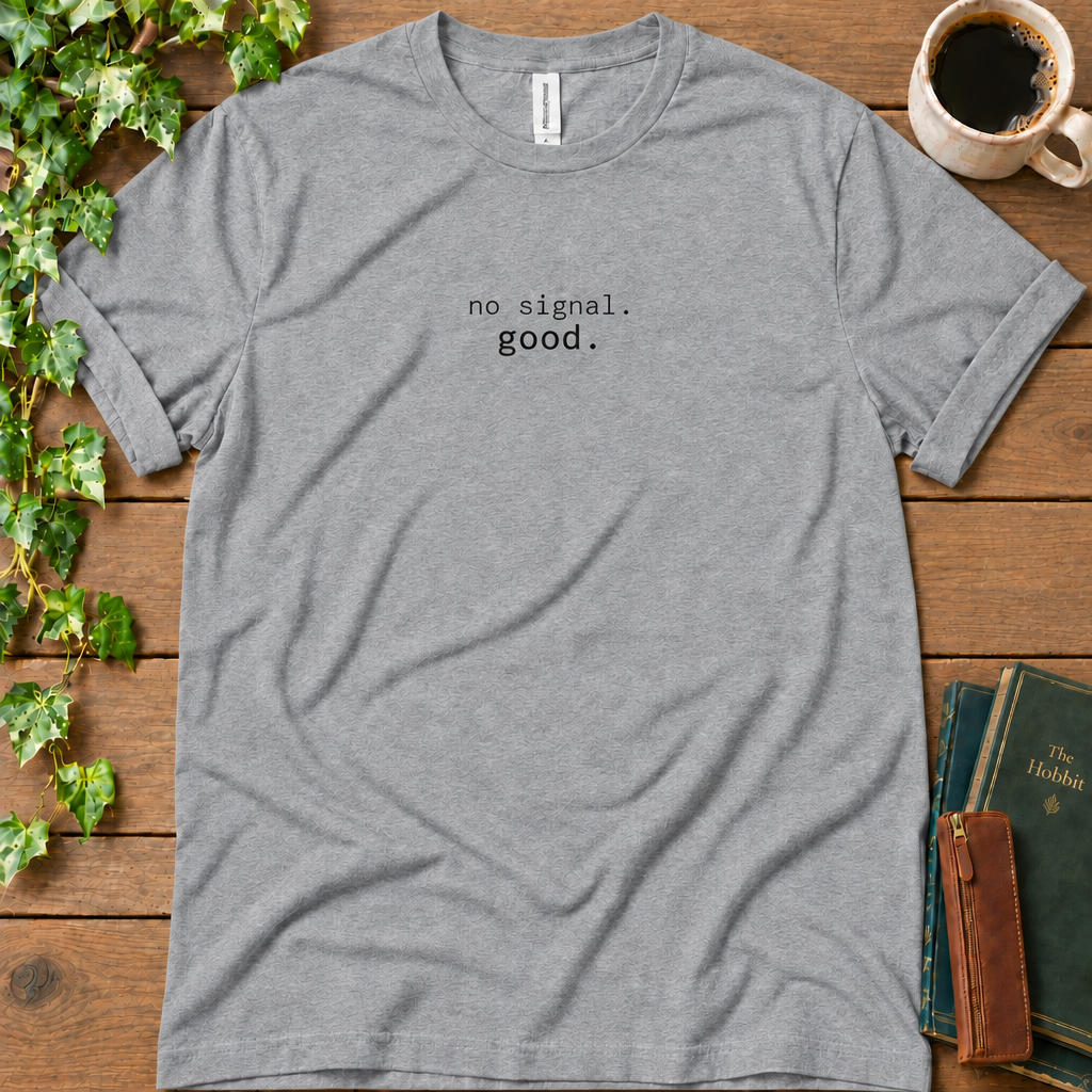 Athletic heather regular-fit tee printed with no signal. good., flat lay on rustic wood with ivy, coffee and vintage books