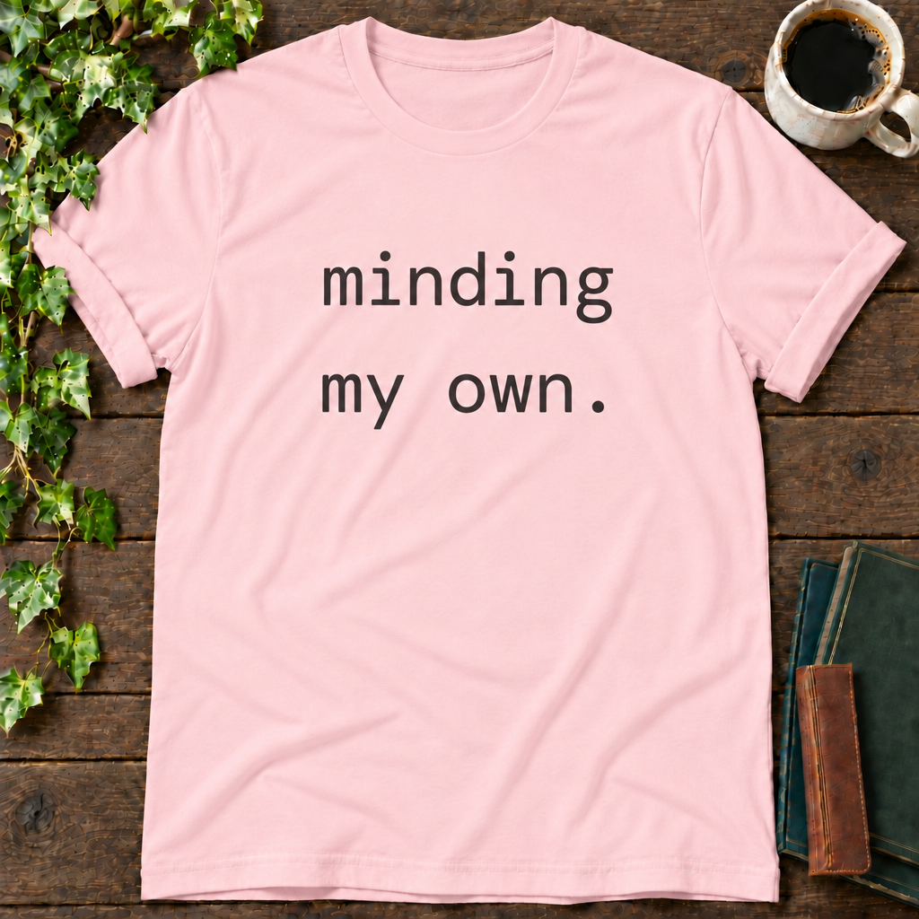 minding my own. pink t-shirt flat lay