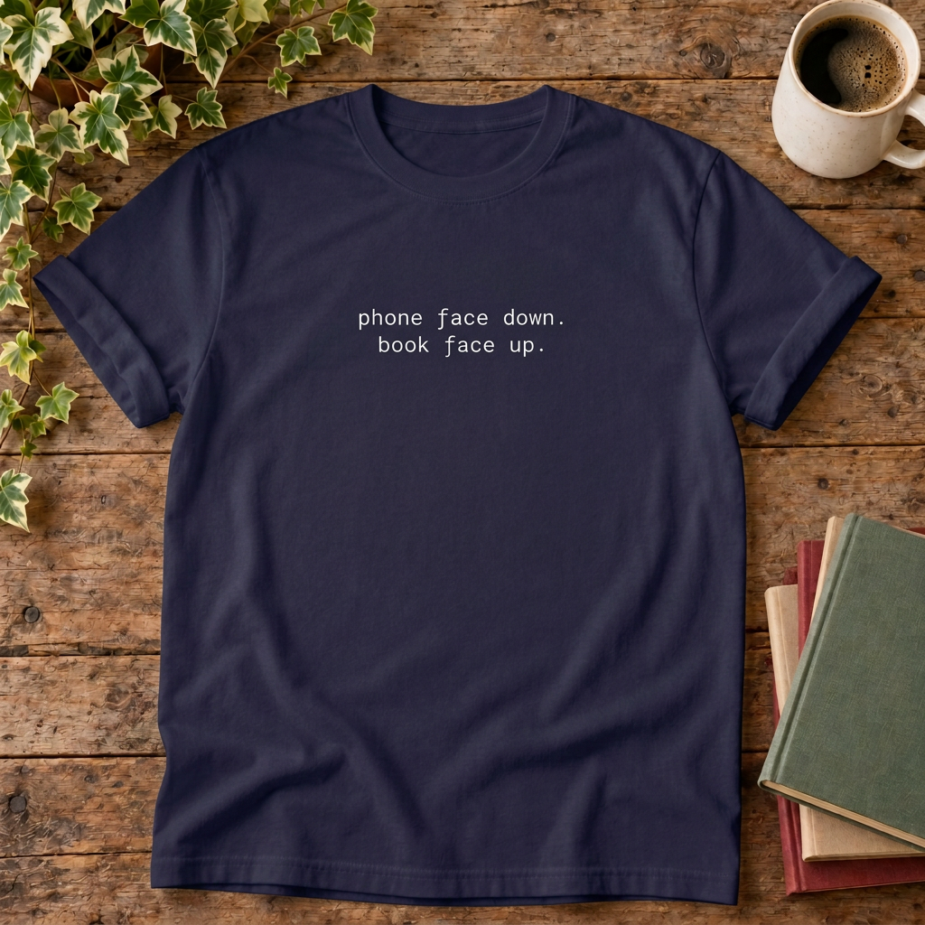 Phone face down T-shirt in True Navy, stylised flat lay with blank neckline