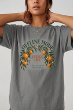 Close-up model wearing offline mode analog life t-shirt in Grey