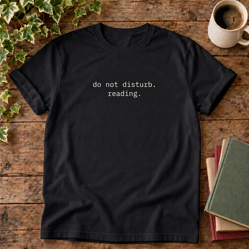 Do not disturb reading T-shirt in Black, flat lay with blank neck label
